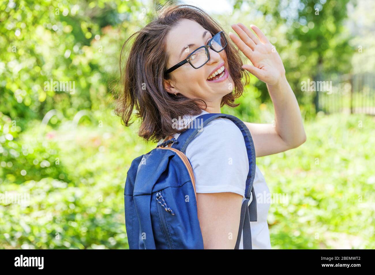 Positive Rested Students Happy beautiful positive student girl in eyeglasses with backpack ...