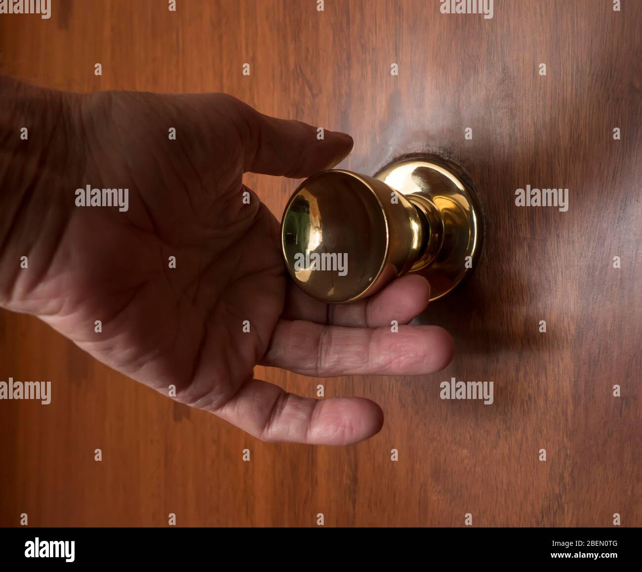 Hand on doorknob Stock Photo