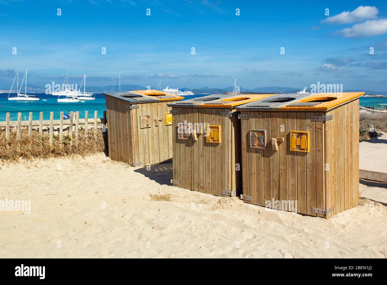 Ses Illetes Beach, Formentera, Balearic Island, Spain. Ecological wooden rubbish bins for separate collection on the beach parking lot. Stock Photo