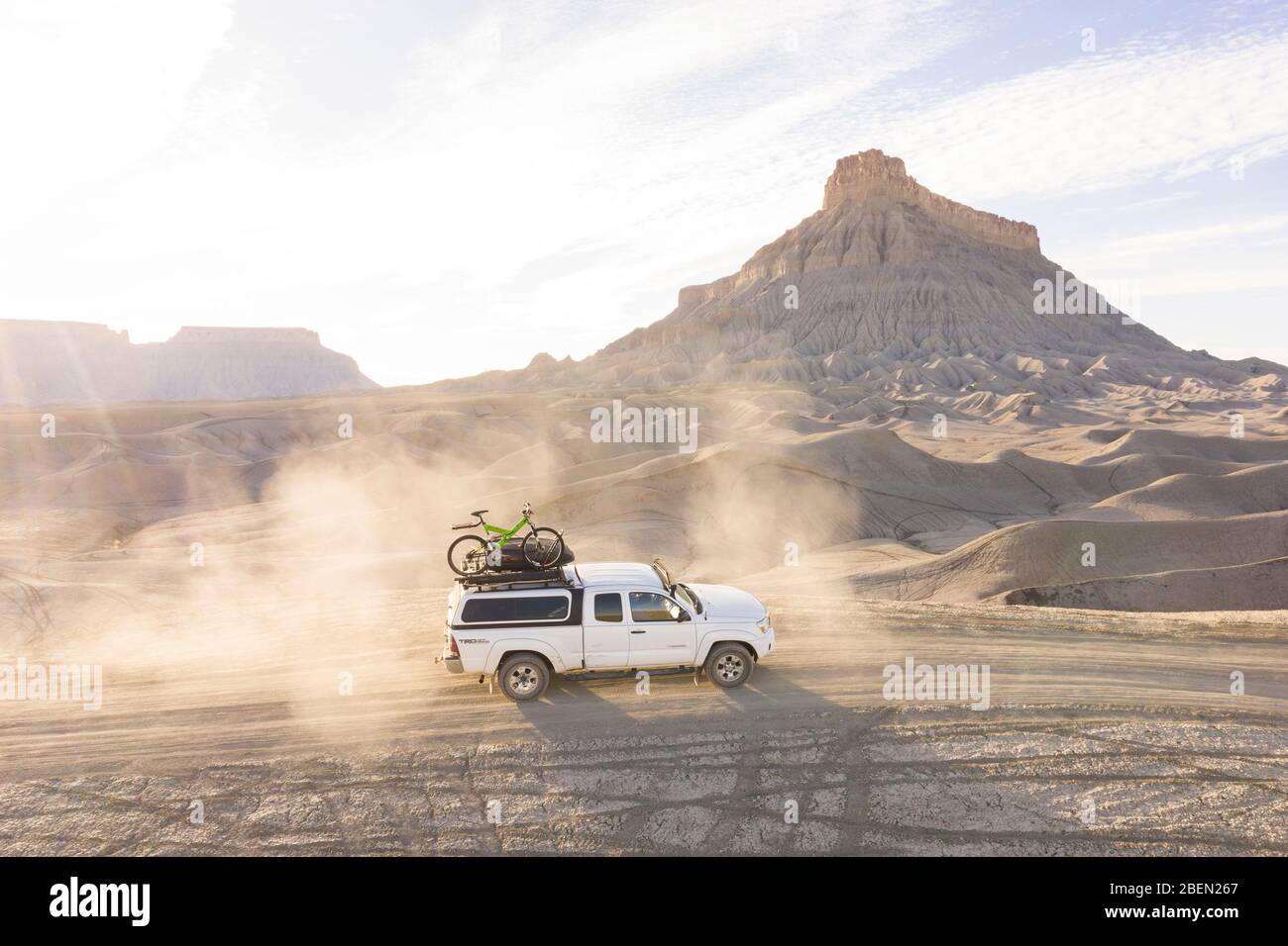 Offroad Truck on Dusty Trail in Utah backcountry canyonlands Stock