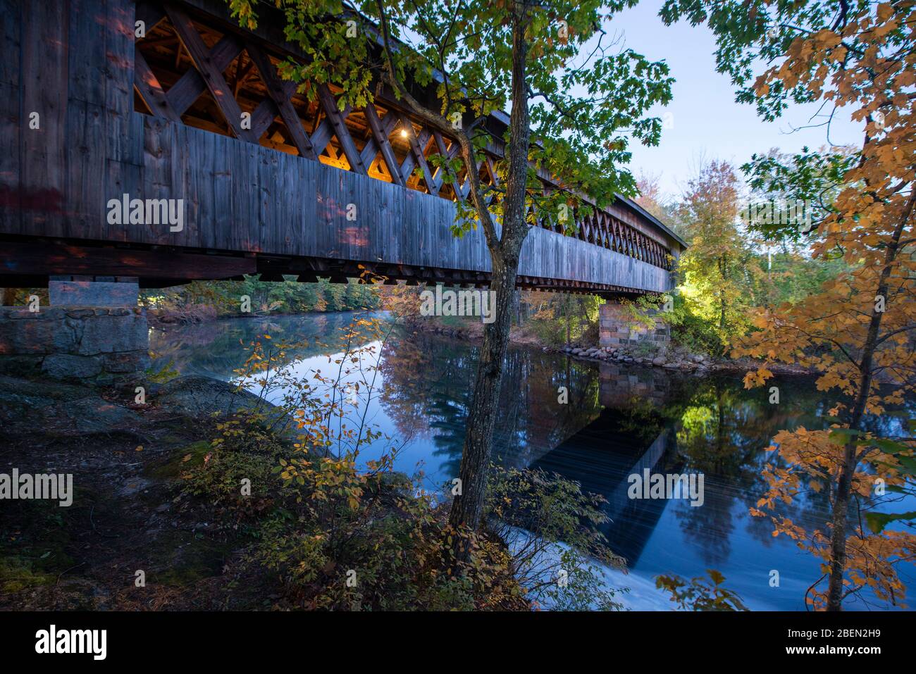 Old covered bridge in new england fall Stock Photo