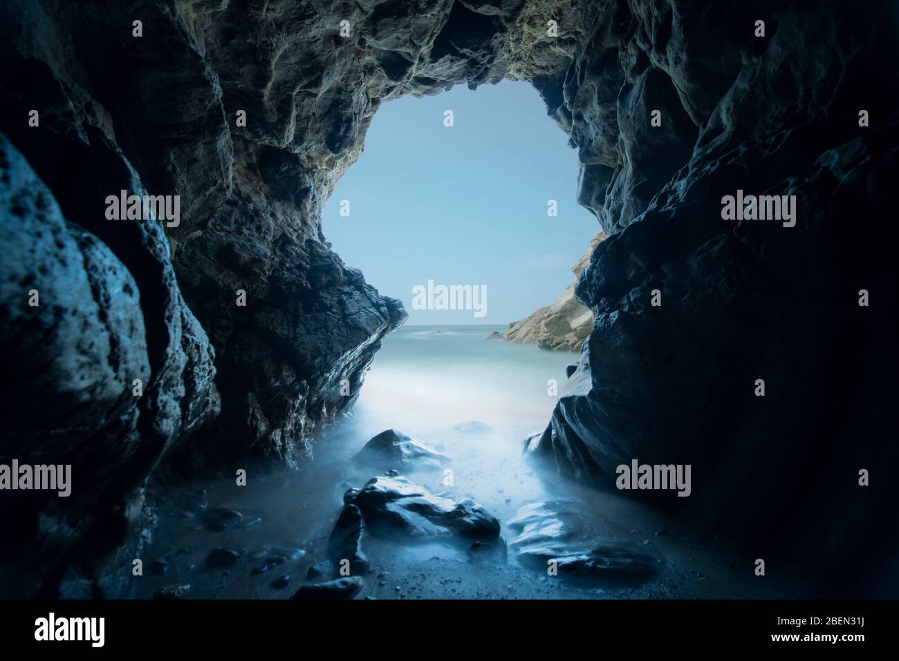 Pacific Waves Crash Through a Sea Cave at Leo Carillo State Park Stock Photo