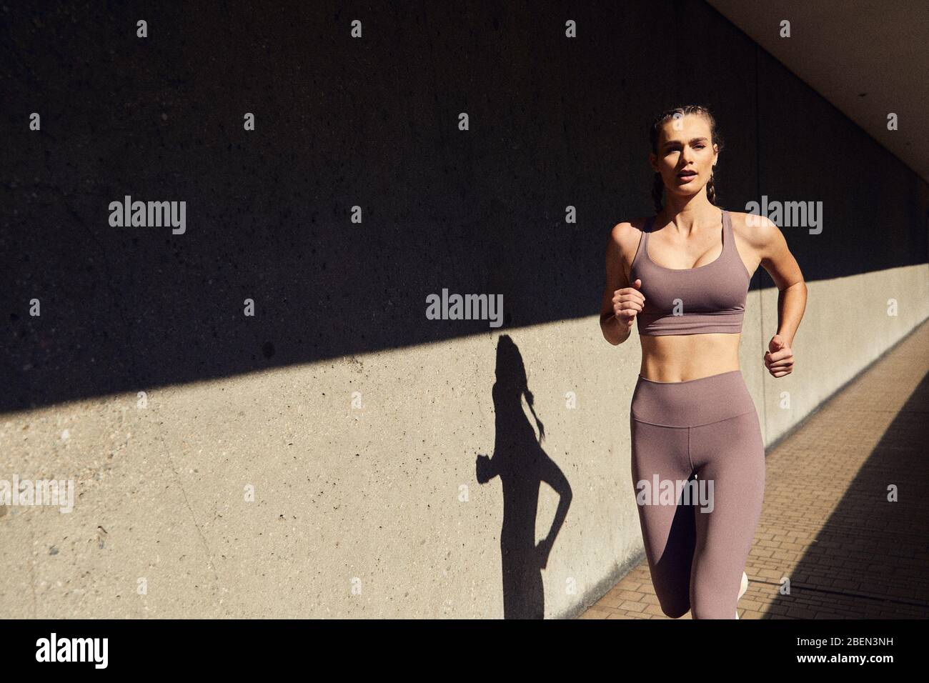 Young girl being active and running in Downtown Los Angeles Stock Photo