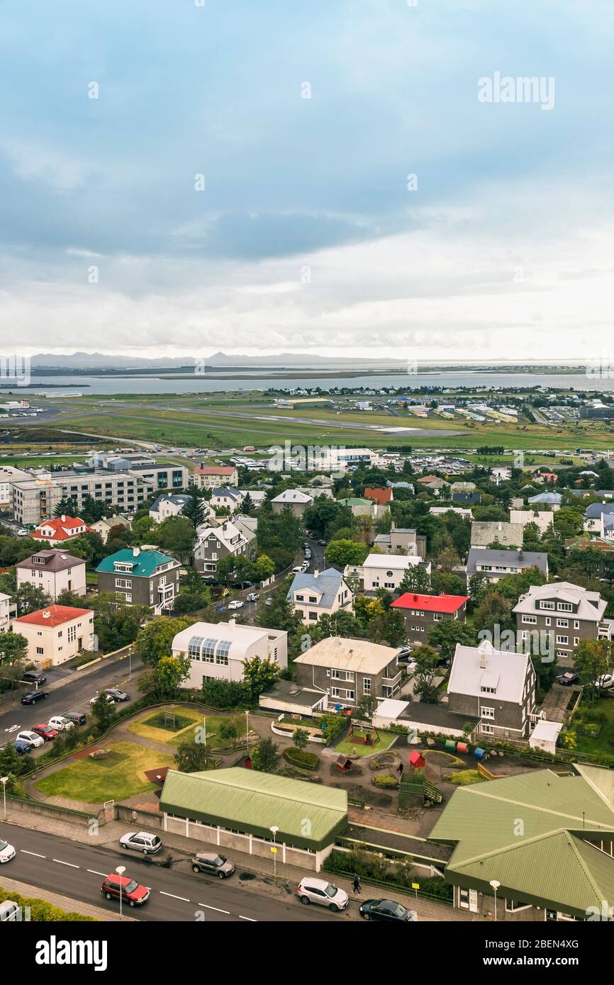 Picturesque aerial view of Reykjavik city, Iceland. Airport and ocean scenery beyond the city Stock Photo
