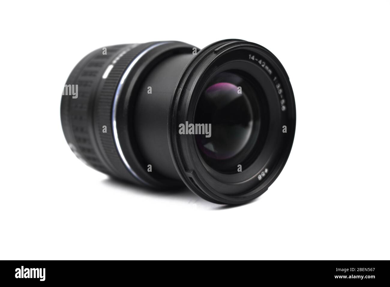 Front view of a single camera lens of black color placed on an isolated
