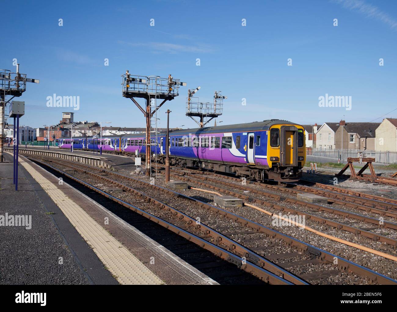 2 Northern rail class 156 sprinter trains departing from Blackpool North station with the bracket semaphore signals Stock Photo