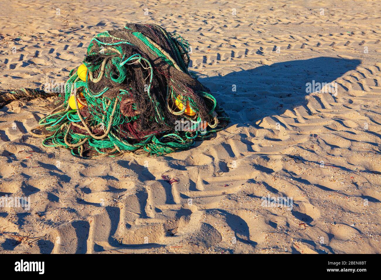 fishing nets in the sandy ocean shore Stock Photo Alamy