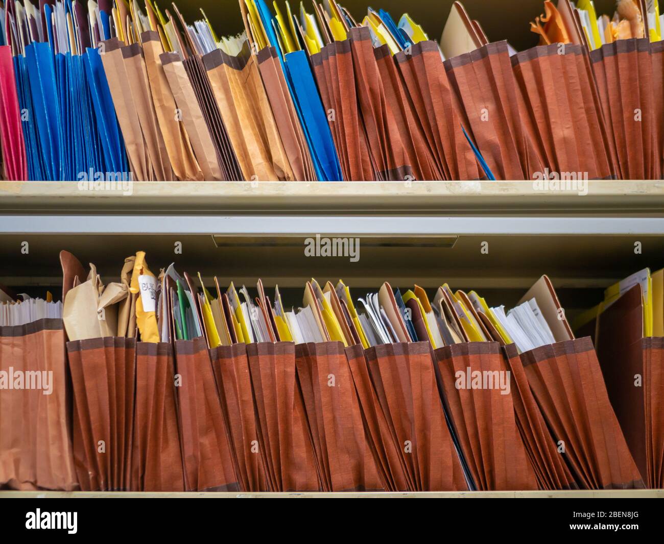 Stacks of document paper and files folder in a filing Stock