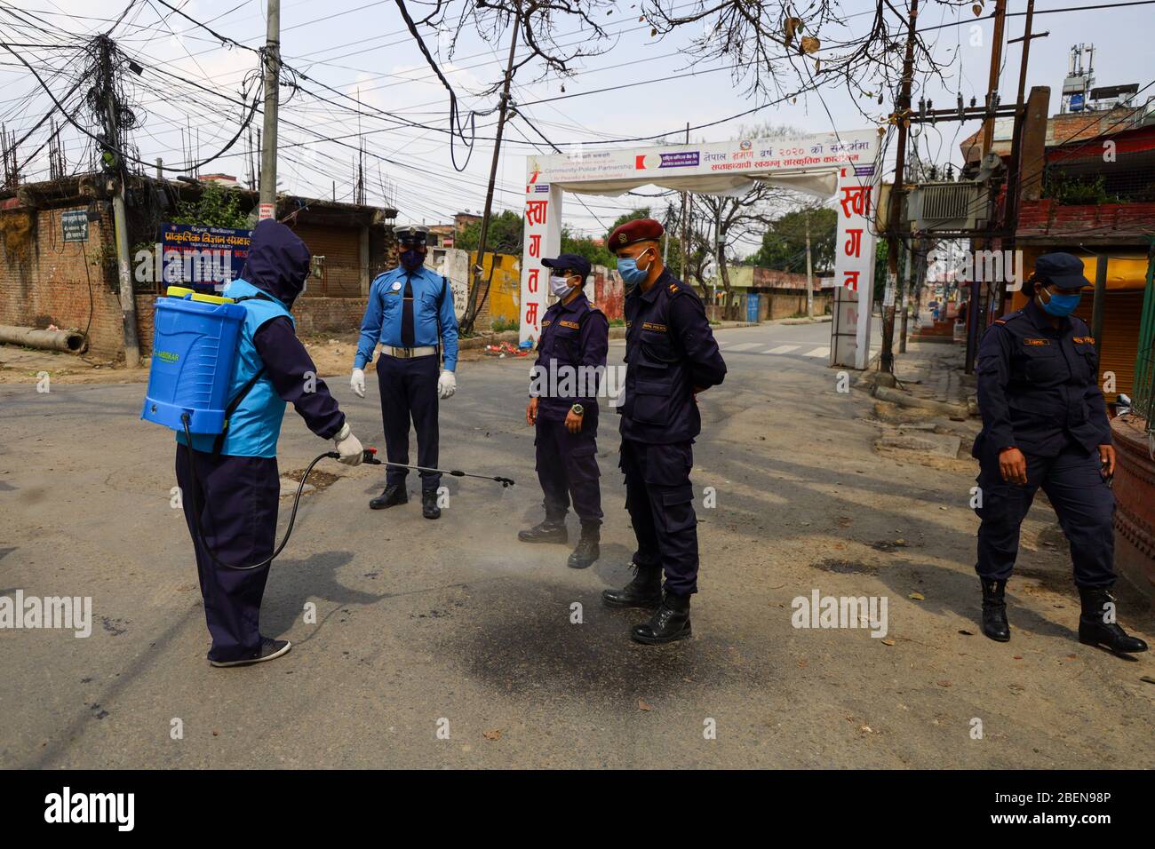Police officers spray disinfectant hires stock photography and images