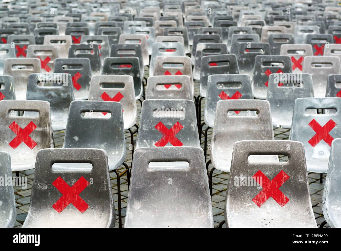 Social distancing concept, warning signs on seats due to coronavirus. Keep safety distance in public place to protect from COVID-19 disease. Stay safe Stock Photo