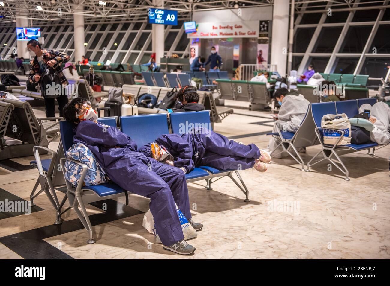 Traveller waiting for flights in protective masks and clothing during Covid-19 outbreak at Bole International Airport in Addis Ababa Ethiopia Stock Photo