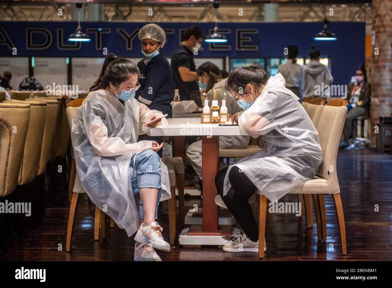 Traveller waiting for flights in protective masks and clothing during Covid-19 outbreak at Bole International Airport in Addis Ababa Ethiopia Stock Photo