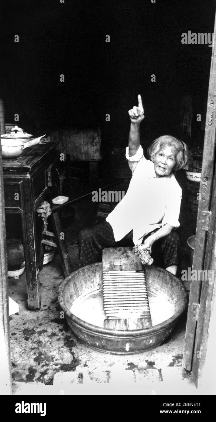 In 1993 an elderly woman doing laundry in Chongqing residents Stock ...