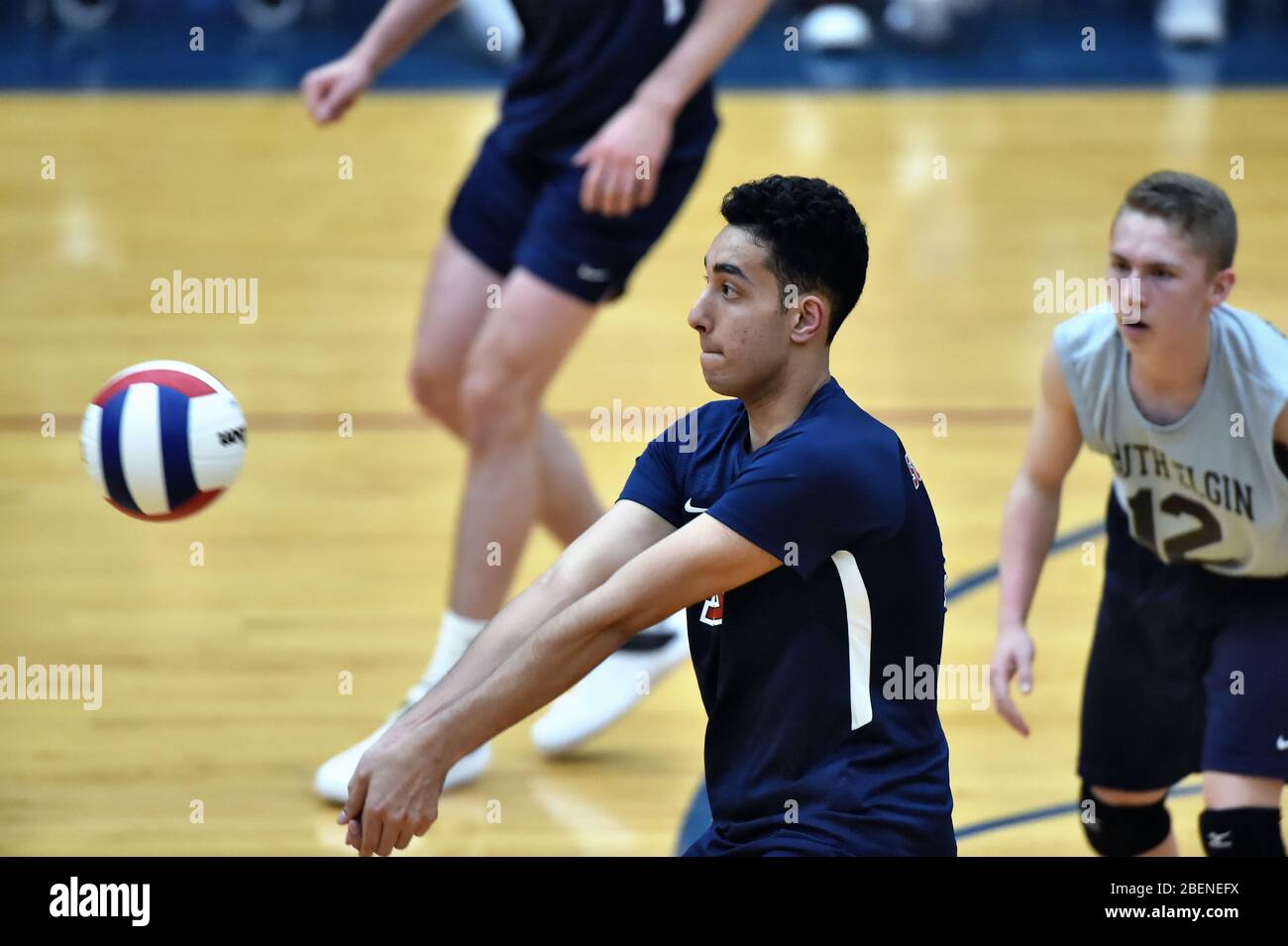 Boys playing volleyball inside hi-res stock photography and images - Alamy