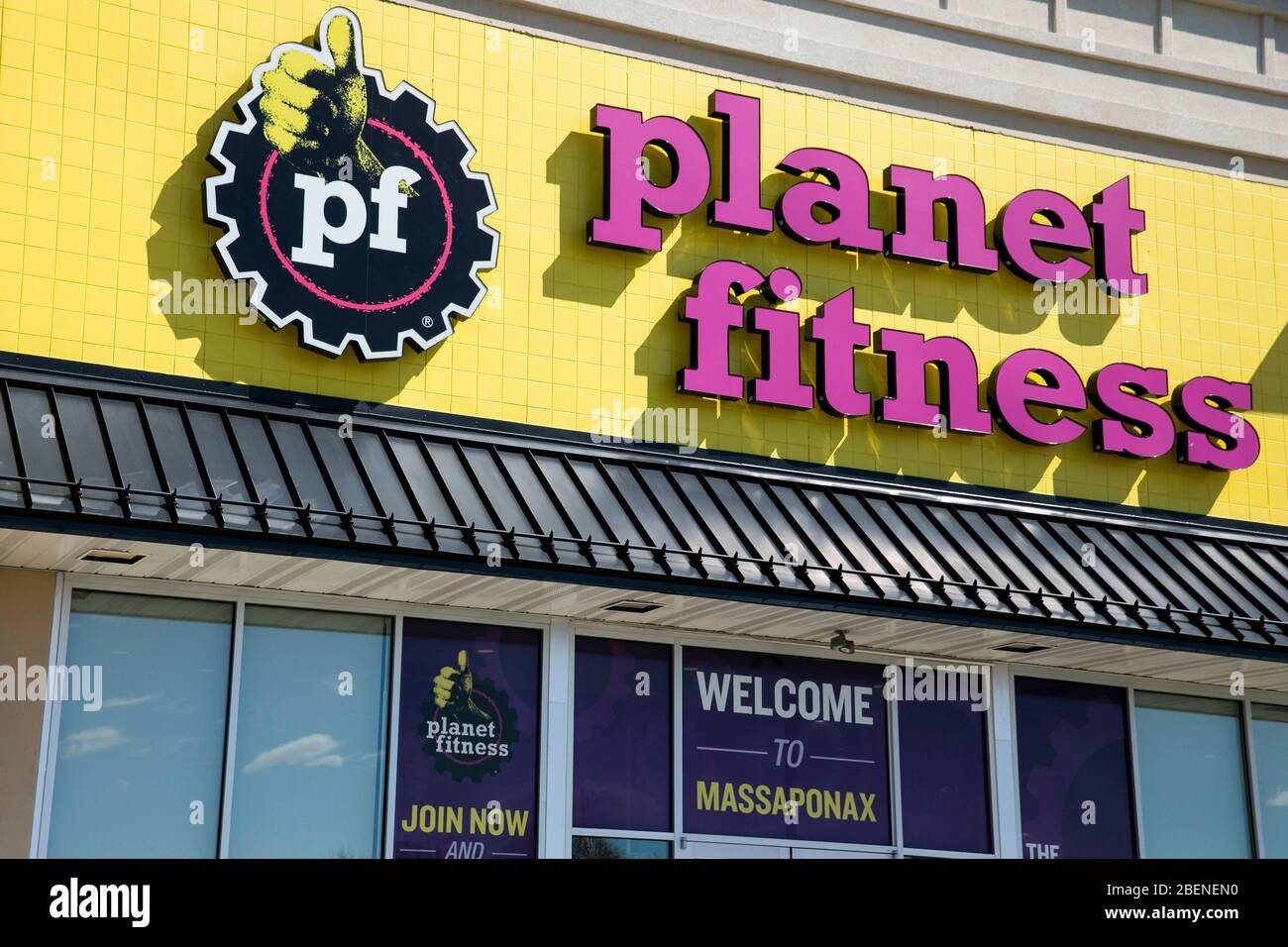 A logo sign outside of a Planet Fitness location in Fredericksburg, Virginia on April 2, 2020. Stock Photo