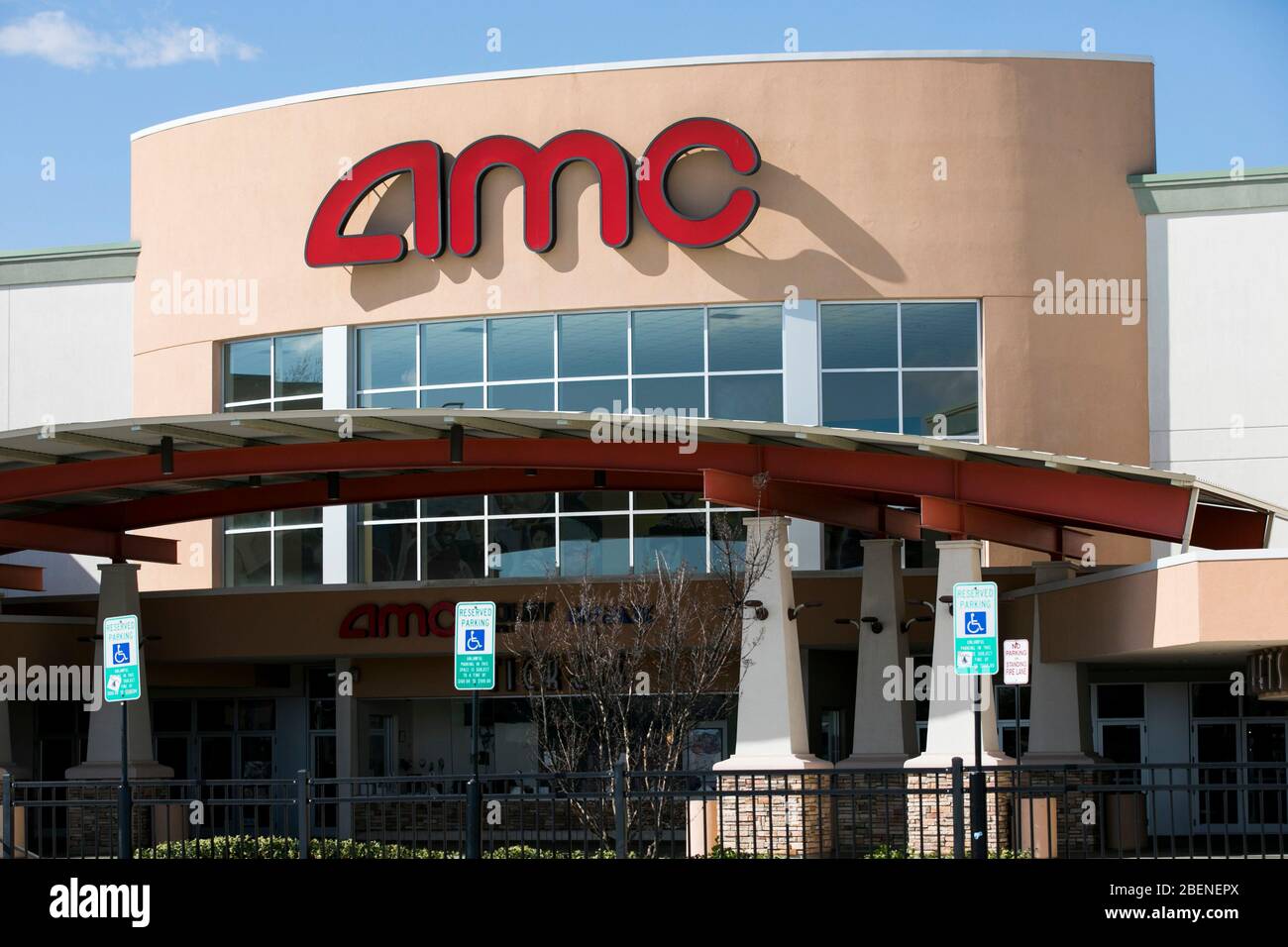 A logo sign outside of a AMC Theaters location in Woodbridge, Virginia on April 2, 2020. Stock Photo