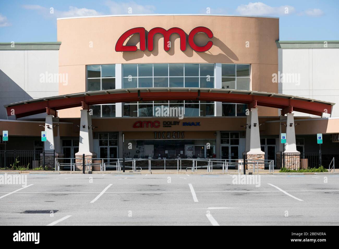 A logo sign outside of a AMC Theaters location in Woodbridge, Virginia on April 2, 2020. Stock Photo