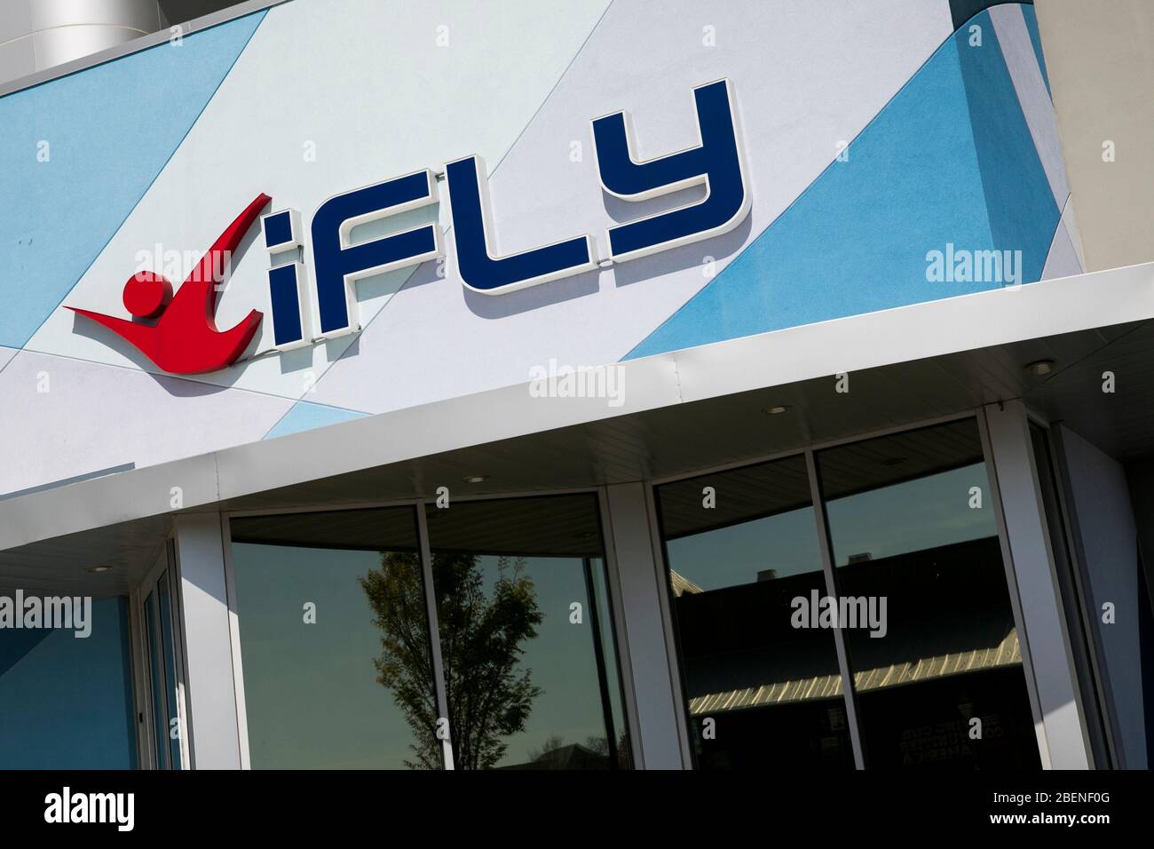 A logo sign outside of a iFly Indoor Skydiving location in Baltimore, Maryland on April 6, 2020. Stock Photo