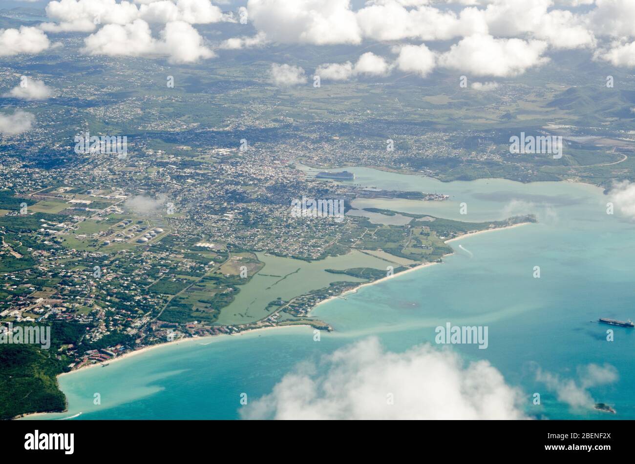 Aerial view of St John's on the Caribbean island of Antigua.  At the centre is the Cruise Port, Fort James, The Cove, Runaway Bay, Runaway Beach, McKi Stock Photo