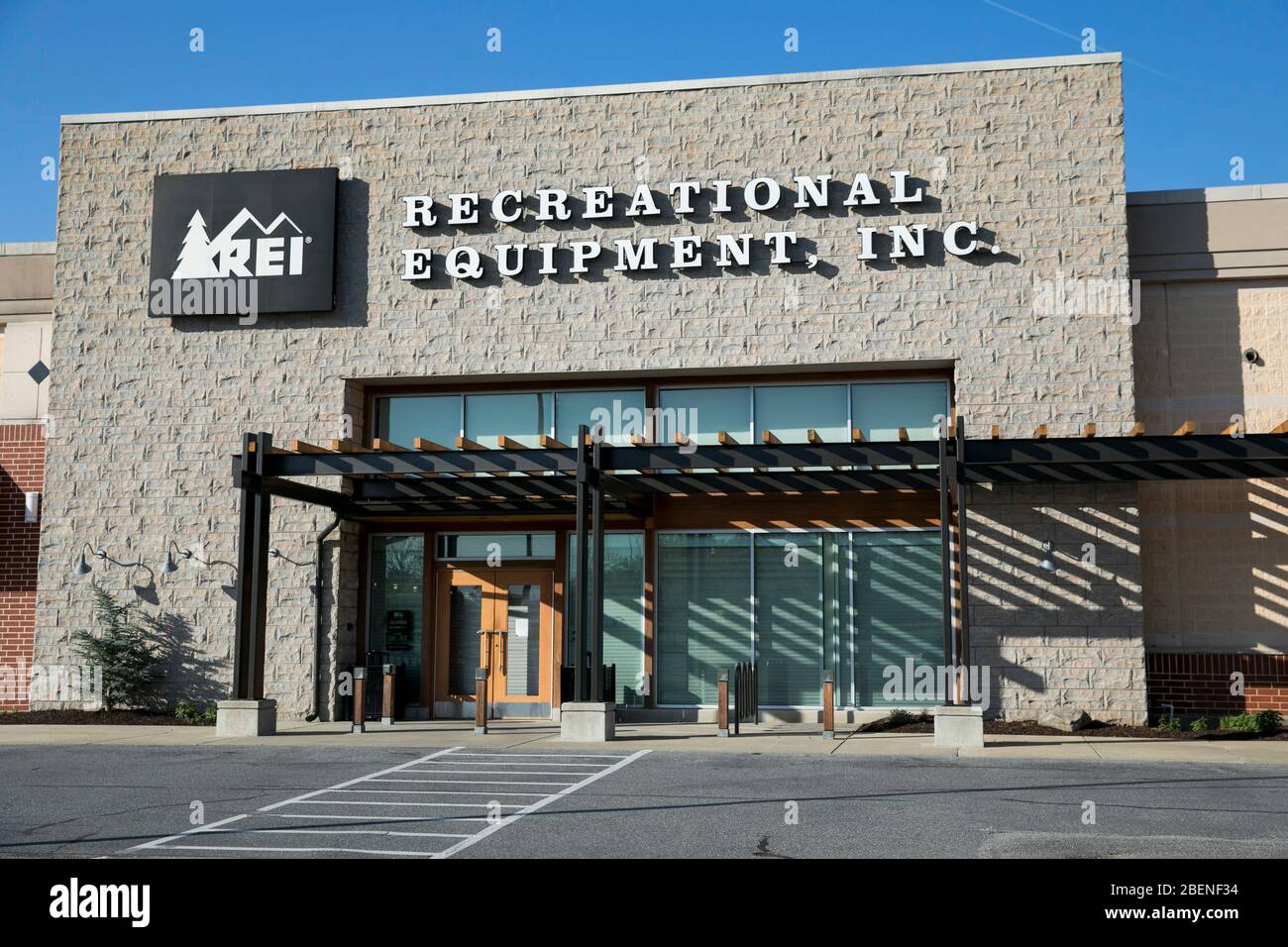 A logo sign outside of a Recreational Equipment, Inc., (REI) retail store location in Columbia, Maryland on April 6, 2020. Stock Photo