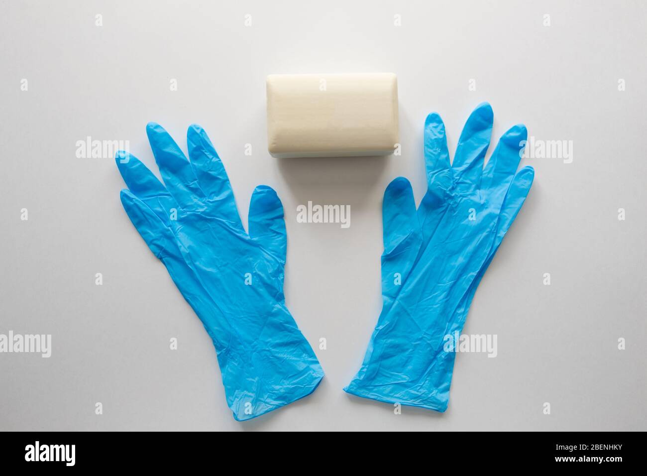 Pair of latex medical gloves, medical masks, sanitizer gel for hand