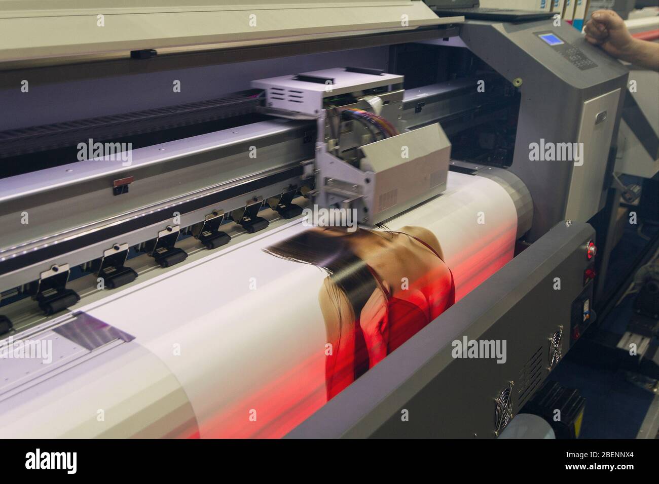 Large format printing machine in operation. Industry Stock Photo