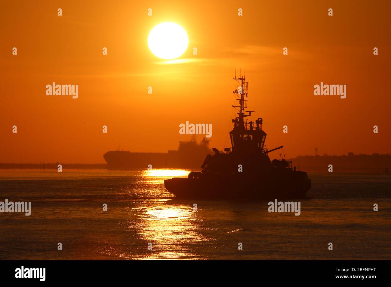 Gravesend, United Kingdom. 15th April, 2020. Vessels on the River Thames at sunrise this morning seen from Gravesend. The Port of London continues to be busy with inbound and outbound ships during the Covid19 lockdown period. Credit: Rob Powell/Alamy Live News Stock Photo