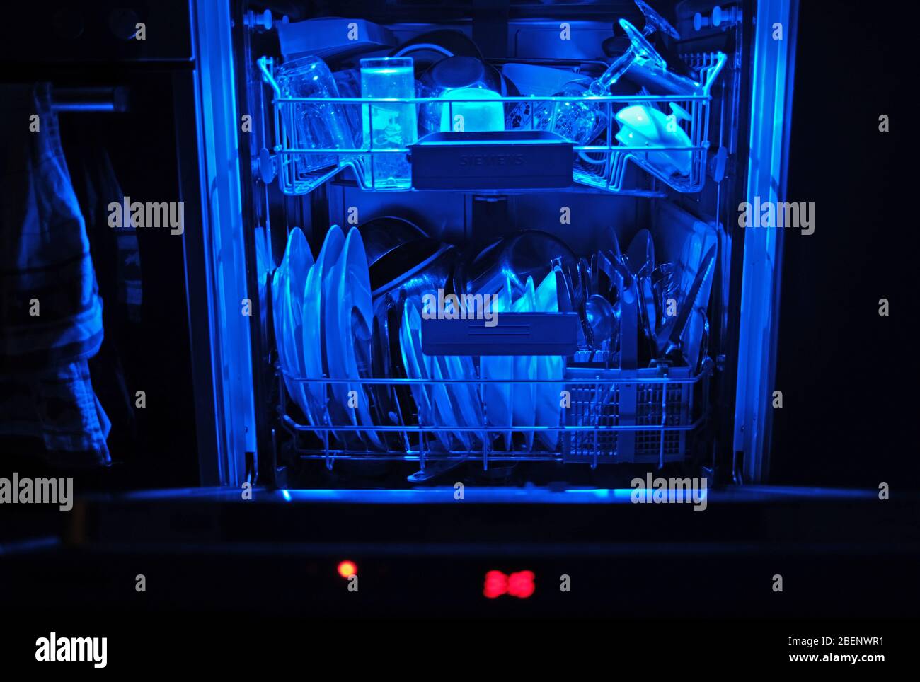 Cologne, Germany. 13th Apr, 2020. Washed dishes are in an open