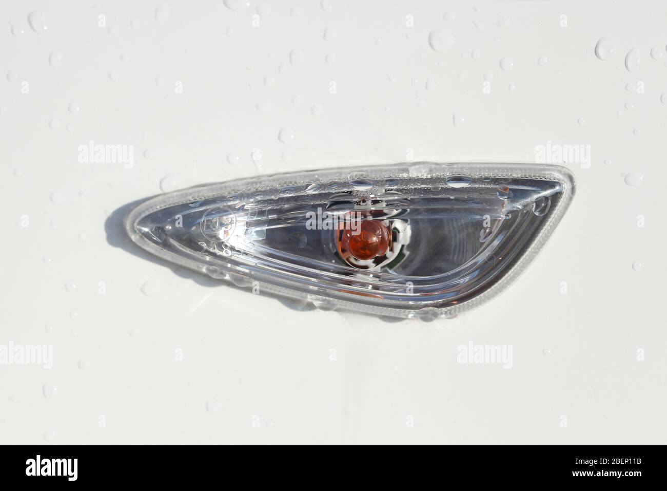 Flashing light, headlights on a white car Stock Photo Alamy