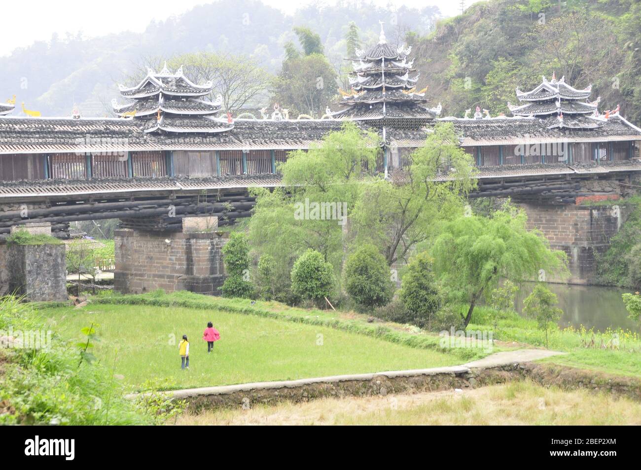 Huaihua, Huaihua, China. 15th Apr, 2020. HunanÃ¯Â¼Å'CHINA-Huangdu dong ethnic cultural village is located in the loess township in the center of the ''baili dong cultural corridor'' of tongdao dong autonomous county in huaihua city. It is a national AAA level scenic spot.The important ancient building general repair bridge in the village, built in the jiaqing period, was destroyed by the flood in 1937, repaired in 1943. With a length of 57 meters and a width of 4.2 meters, it is a pure and unstructured corridor bridge integrating bridge, pavilion and corridor. It is a representative wind and Stock Photo