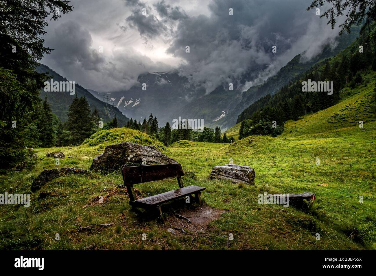 Wooden bench with beautiful landscape background at Hintersee Mittersill, Austria Stock Photo