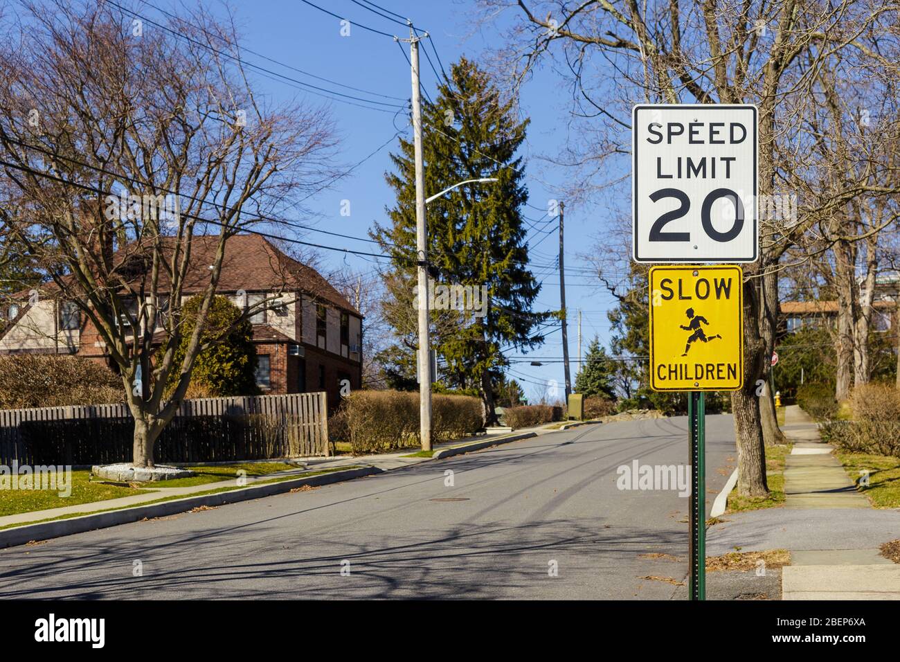 Road sign displaying 20 mph speed limit near the school or kindergarten
