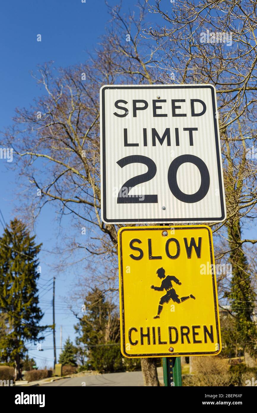 Road sign displaying 20 mph speed limit near the school or kindergarten