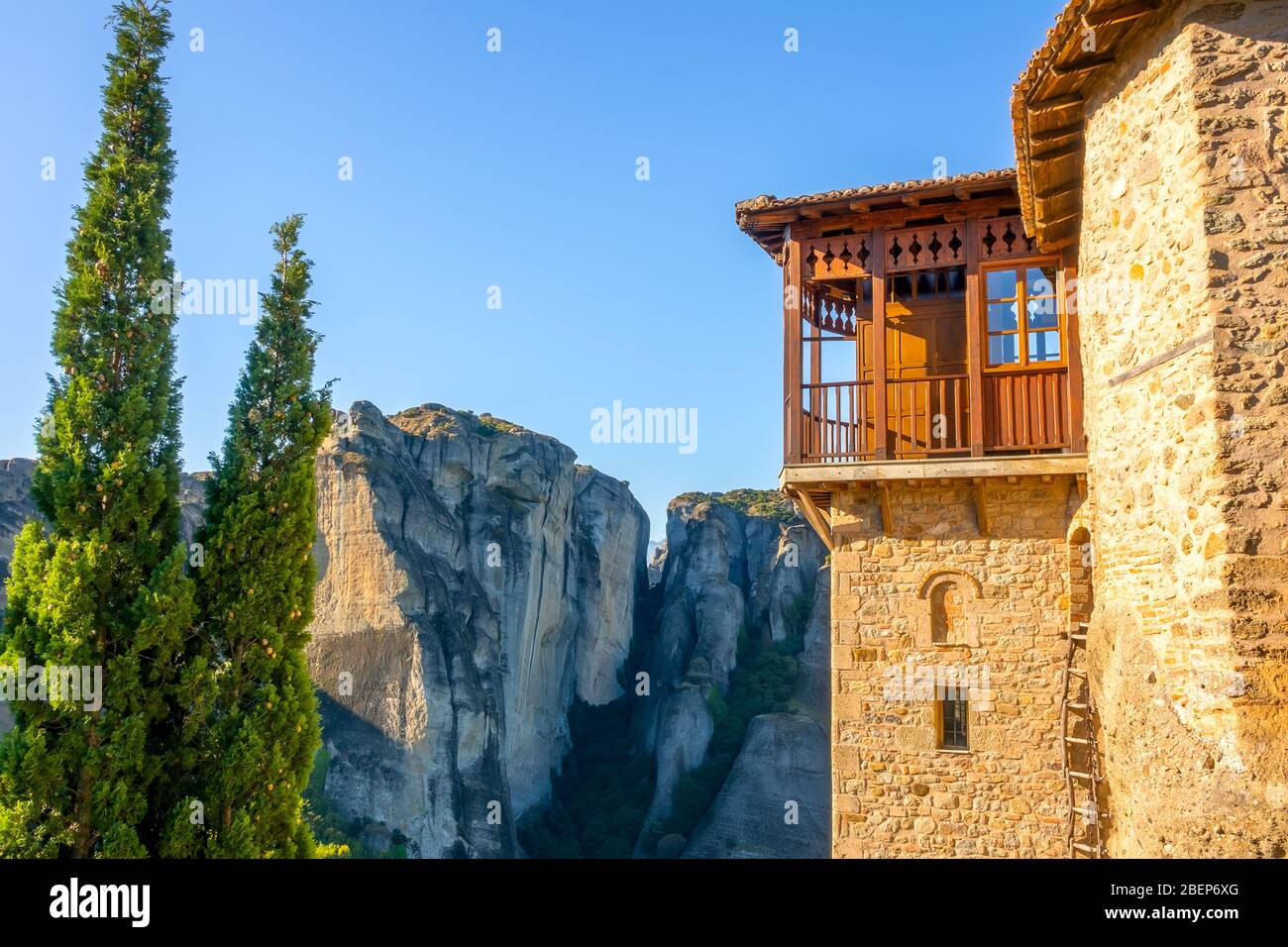 Greece. Summer sunny day in Meteora. Fragment of a monastery building with a balcony and a rope ladder Stock Photo