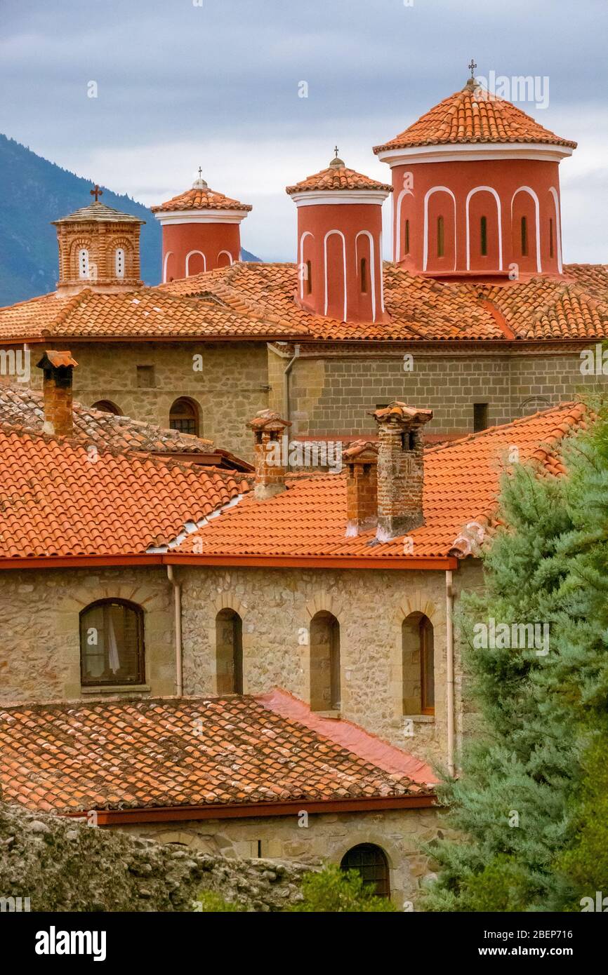 Greece. Summer nasty day in Meteora. Red roofs and crosses on a greek monastery Stock Photo