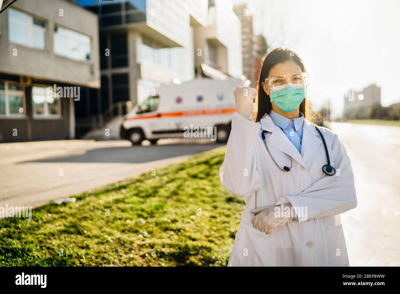 Brave optimistic paramedic in the front lines,working in a isolation hospital facility with infected patients.Covid-19 emergency room triage doctor wi Stock Photo