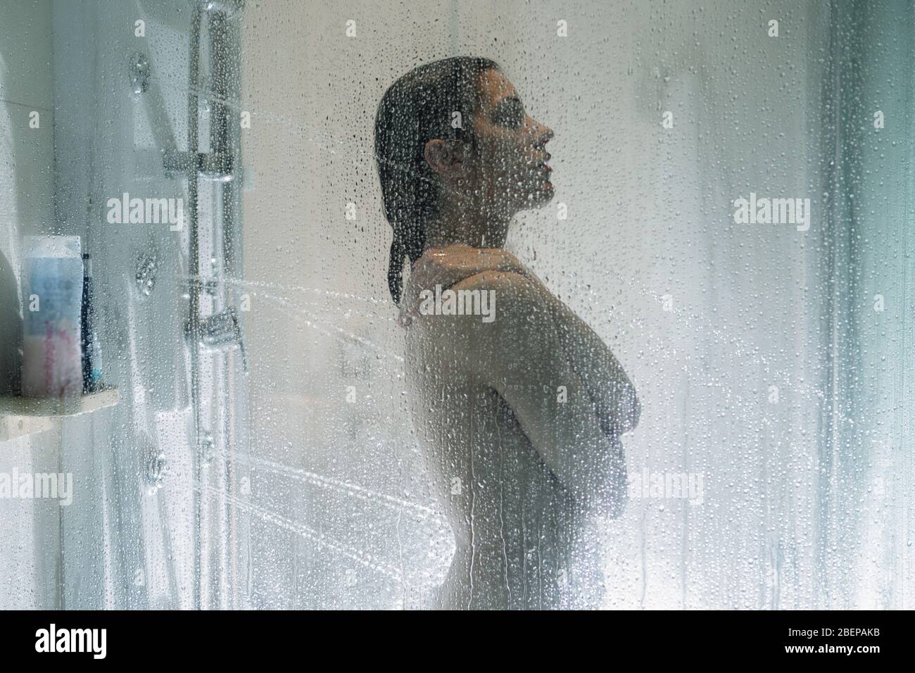 Night shower.Taking relaxing massage shower.Self care moment.Personal