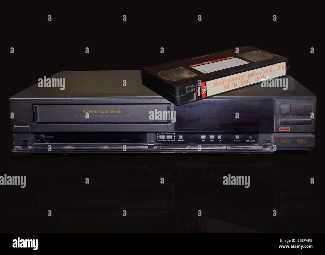 Rare Vintage Old Video Cassette Recorder or VCR with video tape over it