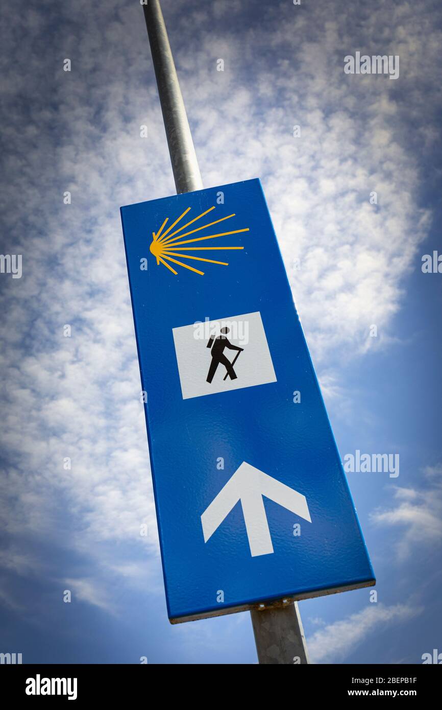 Sign indicating direction of travel to pilgrims on the Camino de Santiago, or The Way of Santiago, Navarre, Spain. Stock Photo