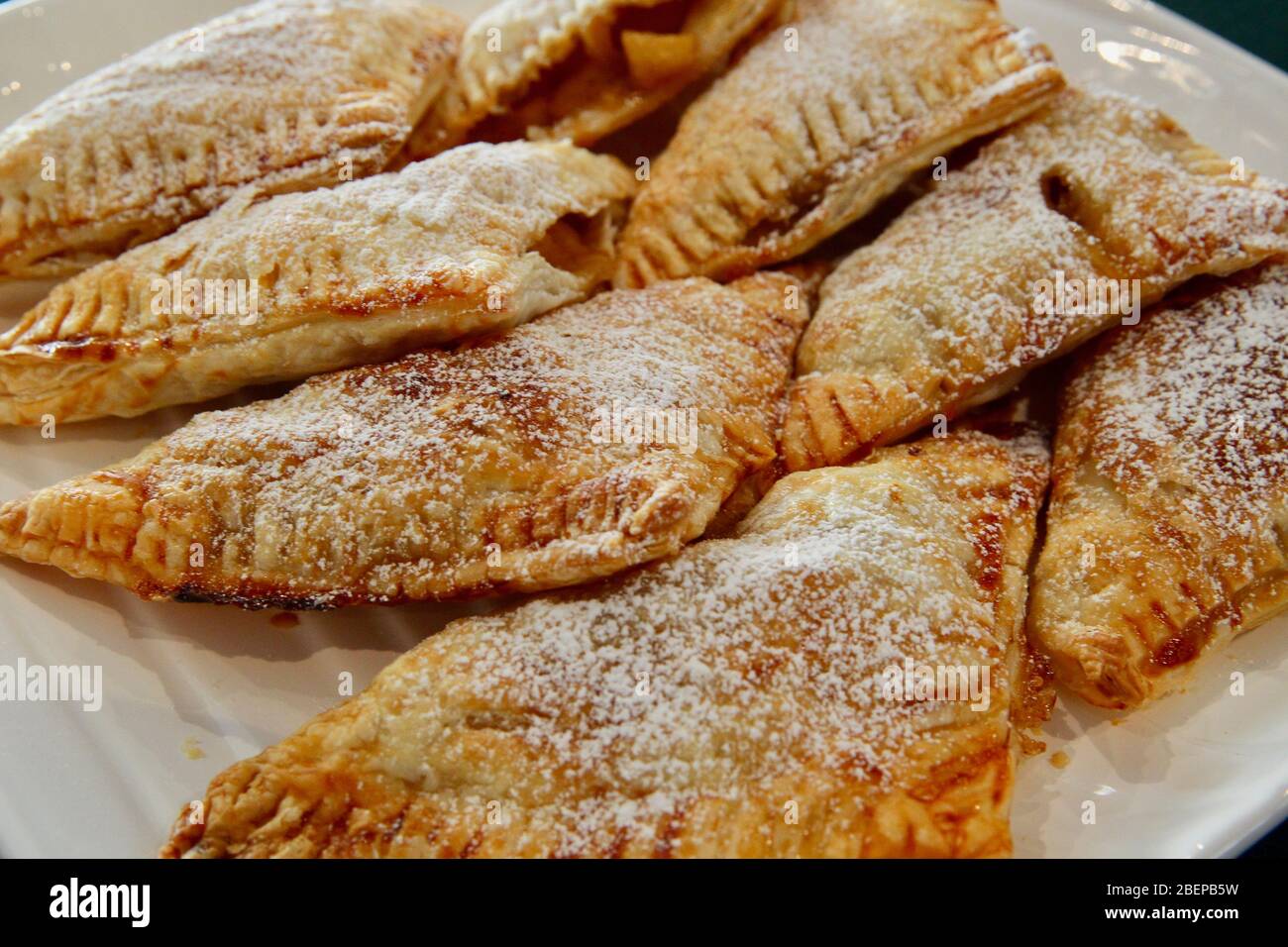 Homemade apple turnover with icing sugar. Stock Photo