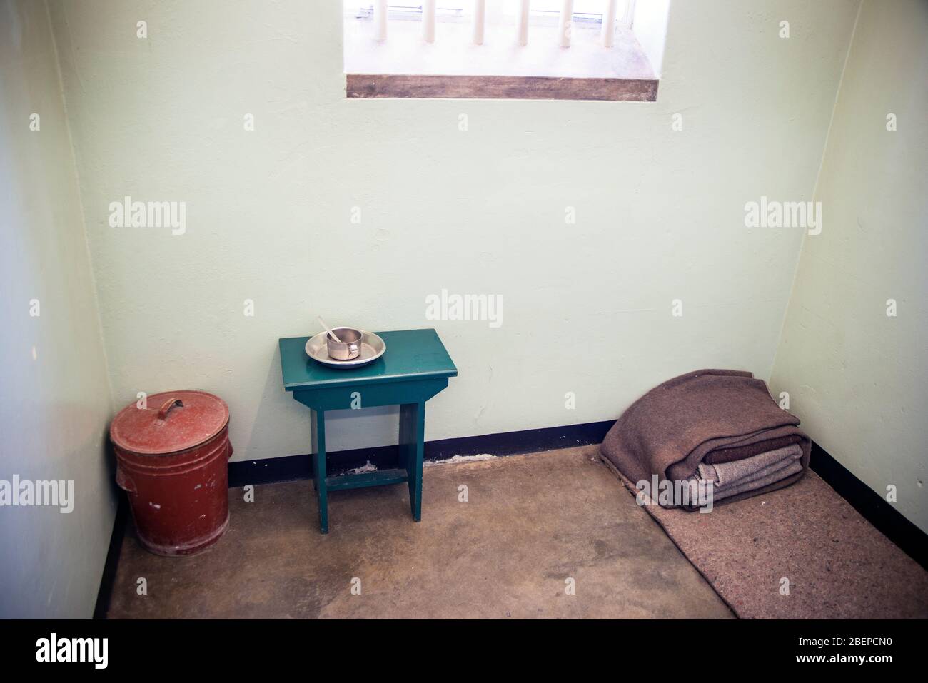 This is the cell where Nelson Mandela slept for 18 years on Robben Island. He was let out for most of the day. It is a big tourist attraction now. Stock Photo