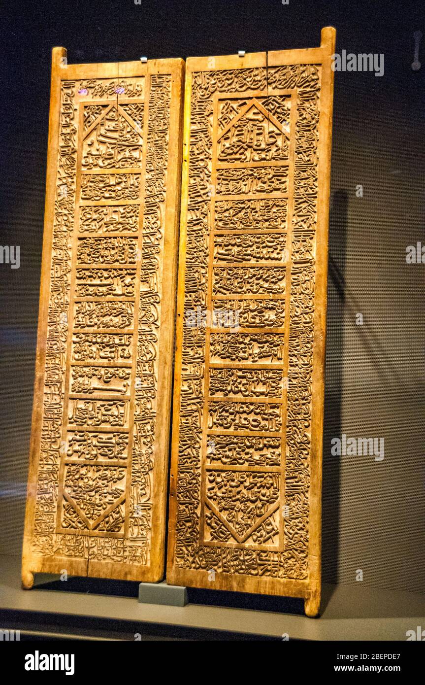 A pair of carved doors from Iran signed by Ghulam Hussein and dated to 1051AH (1641-2AD) on display in Doha’s Museum of Islamic Art. Stock Photo