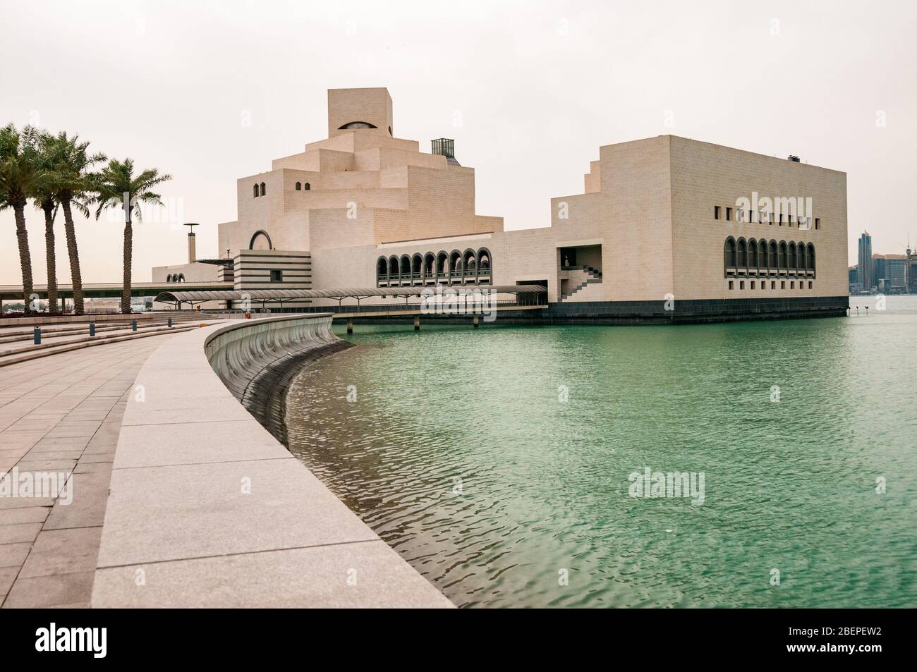 The Museum of Islamic Art seen from the surrounding park area jutting out into the Persian Gulf, Doha, Qatar. Stock Photo