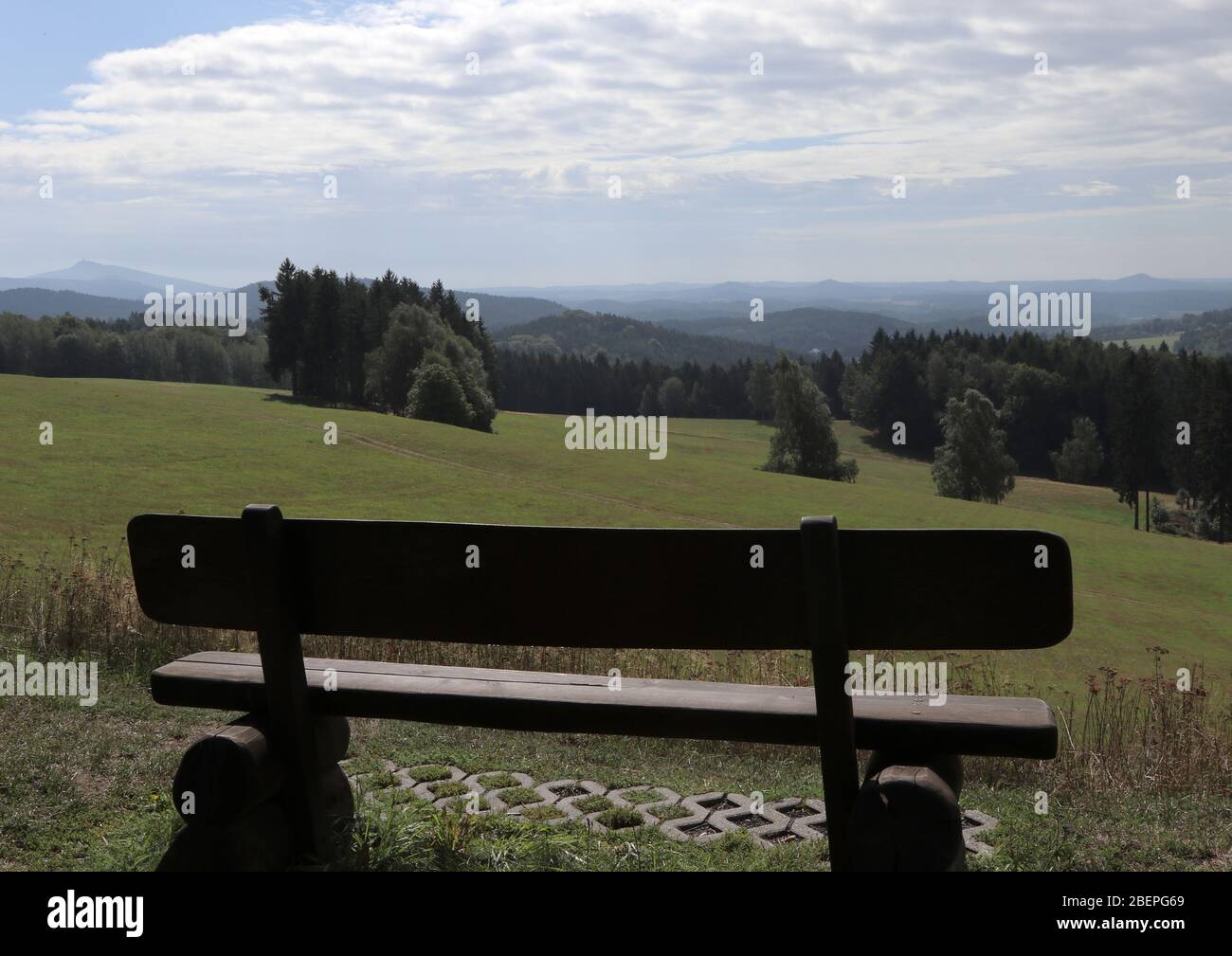 Bank with a view of the green at 528 m above sea level, taken 18.08.2019 in Lueckendorf, which belongs to the spa town of Oybin in the Zittau Mountains on the border with the Czech Republic and Poland. Emperor Napoleon is said to have interrogated the local judge Ehrlich on August 8, 1813, in order to find out the direction of the Austrians after Saxony. Photo: Peter Zimmermann | usage worldwide Stock Photo