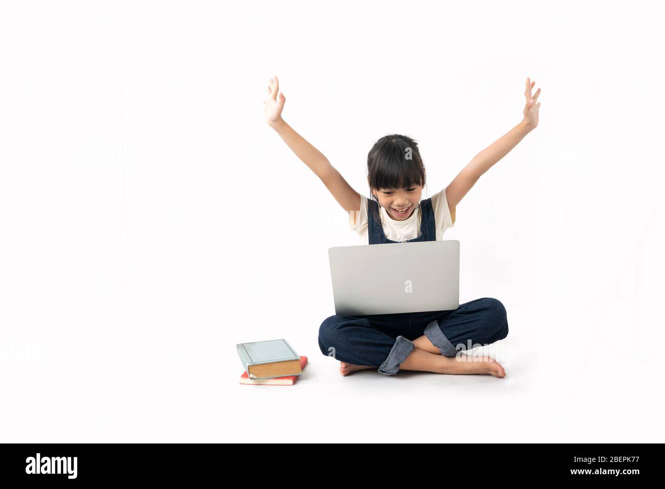 young Asian glad and happy girl student looking on laptop isolated on white  background, searching internet and get knowledge concept Stock Photo - Alamy, image size:1300x956