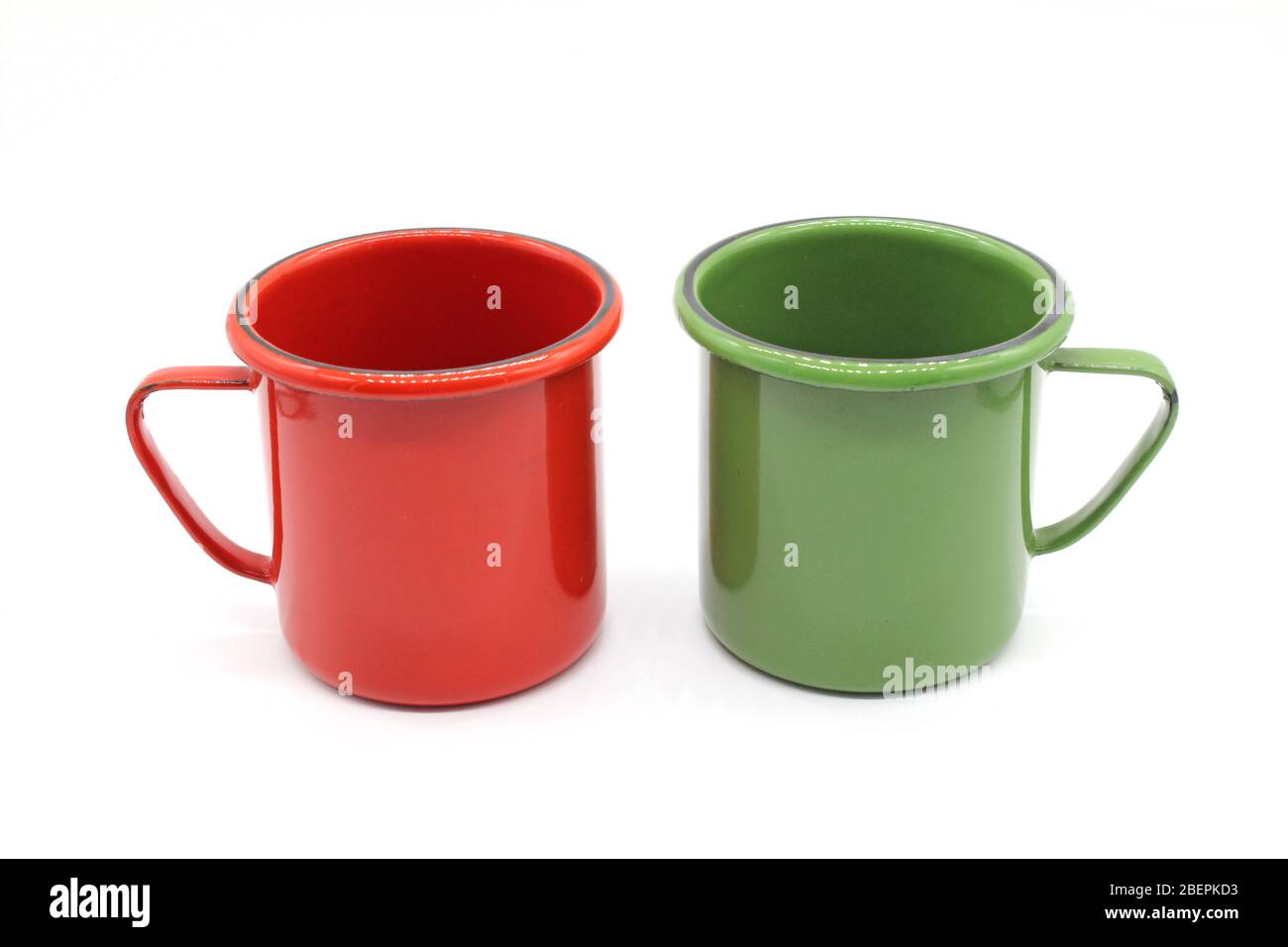 Enameled mugs, isolated on a white background Stock Photo