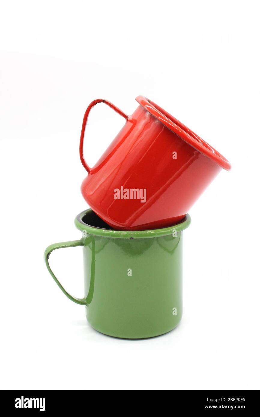 Enameled mugs, isolated on a white background Stock Photo