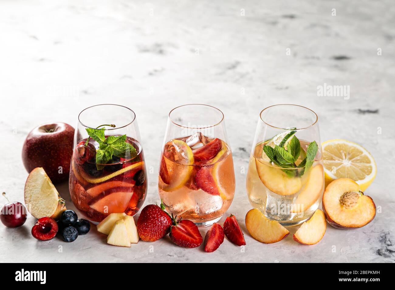 https://c8.alamy.com/comp/2BEPKMH/selection-of-sangrias-red-pink-white-and-ingredients-2BEPKMH.jpg