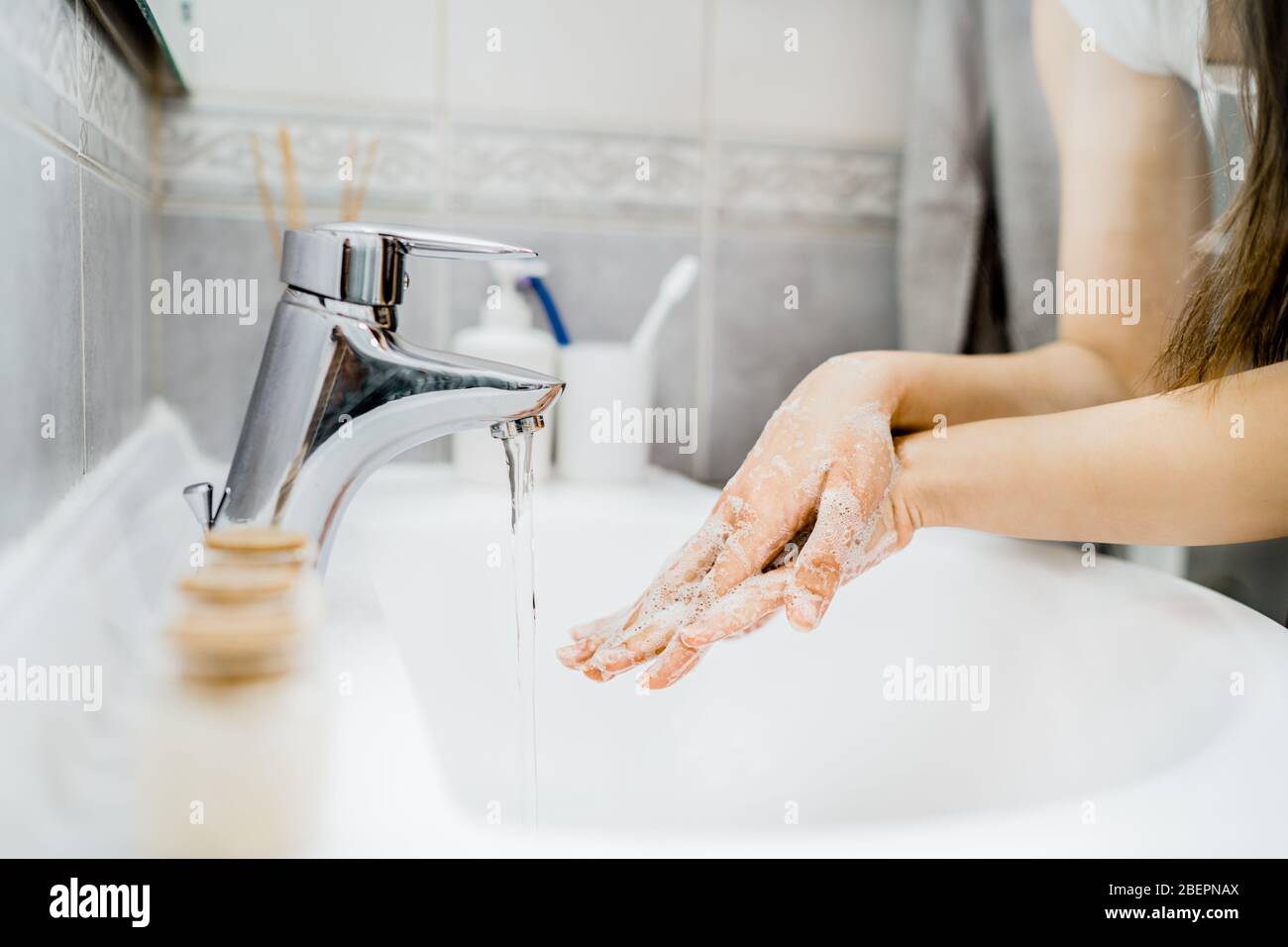 Antiseptic hand washing procedure with soap and water in the bathroom.Decontamination steps of hand hygiene routine.Cleaning hands, palms, interlaced finger Stock Photo