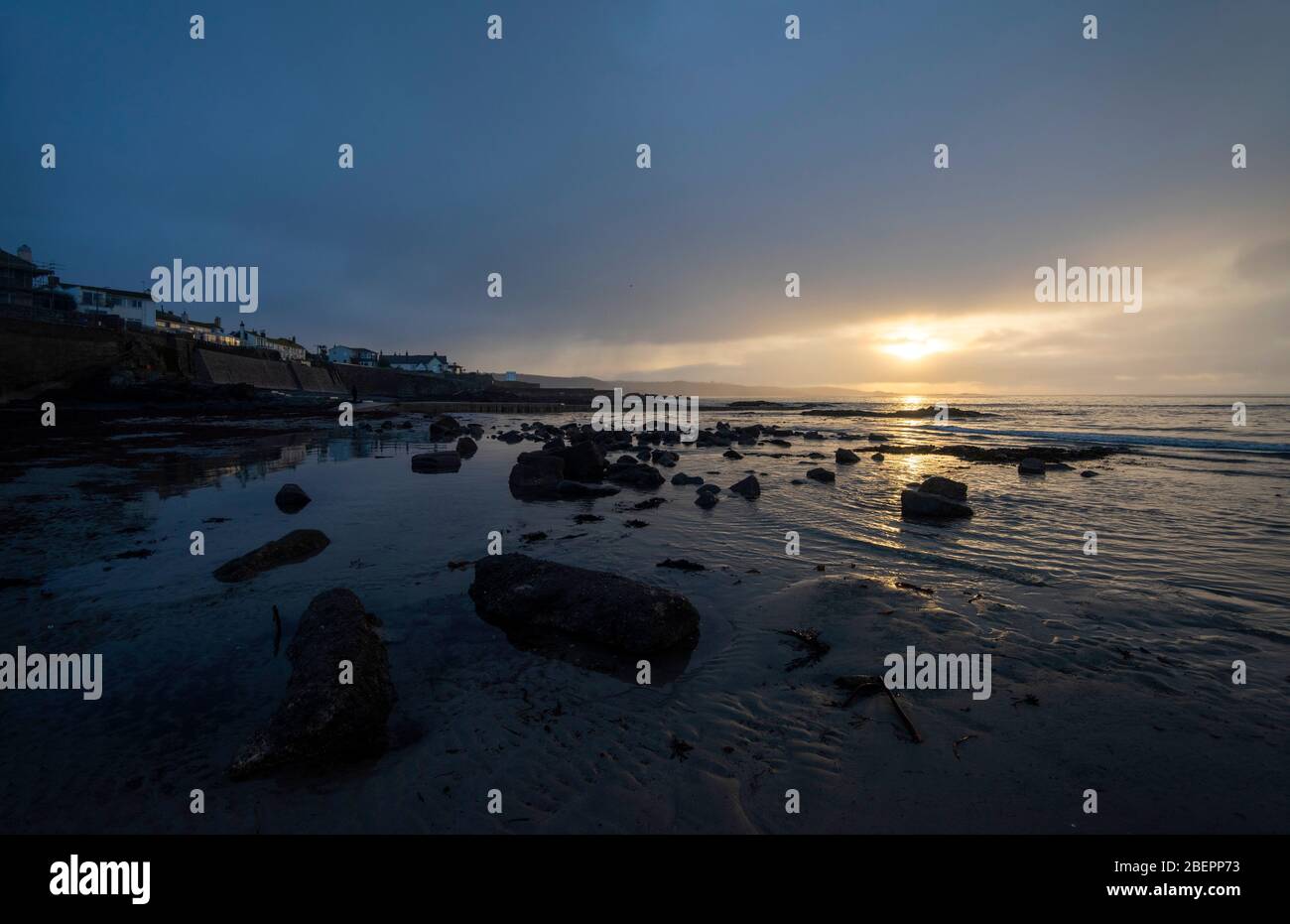 Sunrise on the beach at Marazion in Cornwall England UK Stock Photo